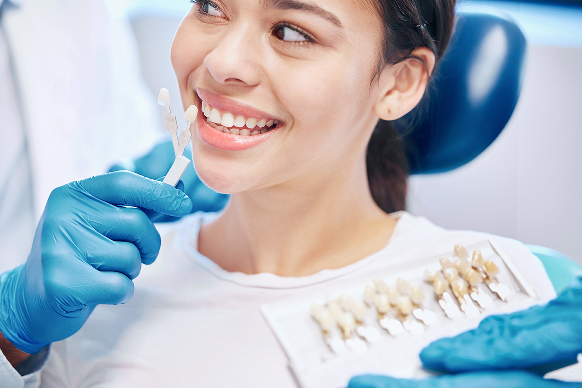 woman with hygienist during a consultation for Porcelain Veneers in West Fargo, ND