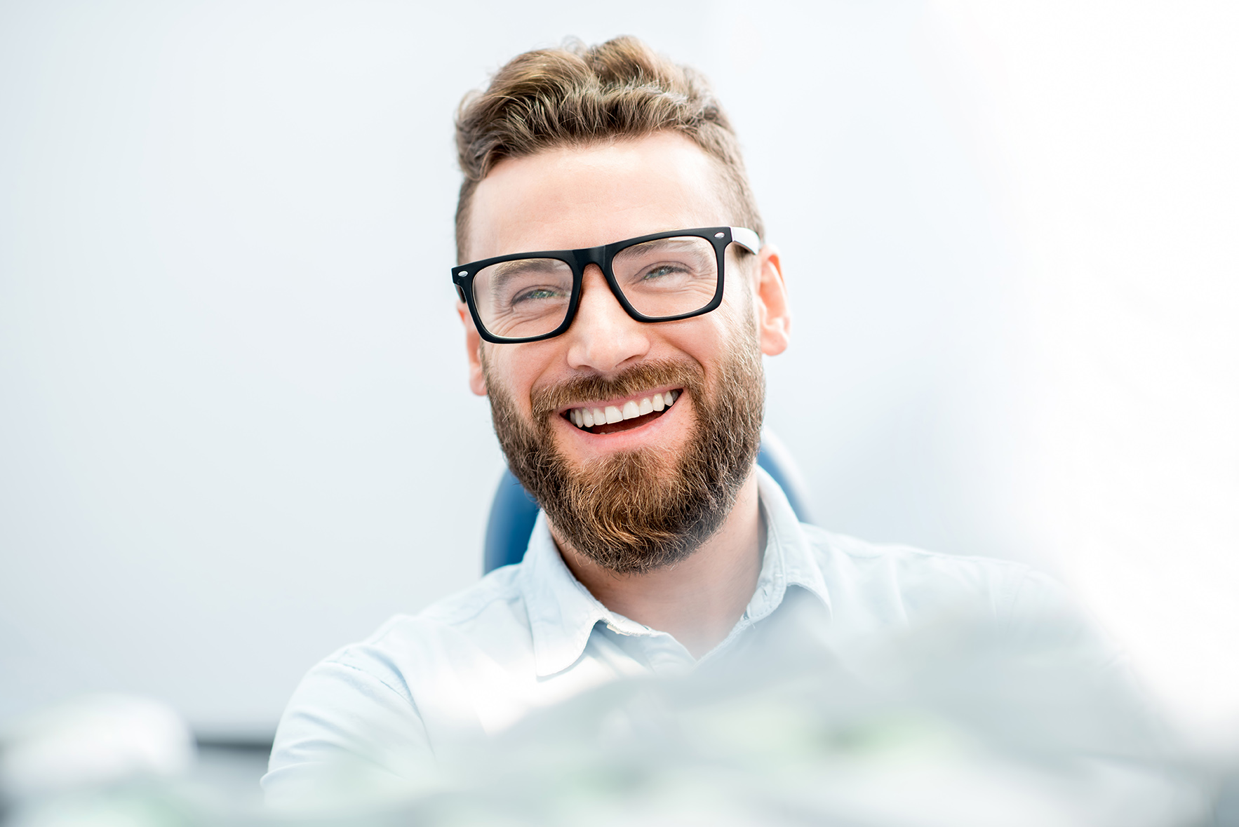 man smiling during sheyenne dental appointment for Dentures in Fargo, ND