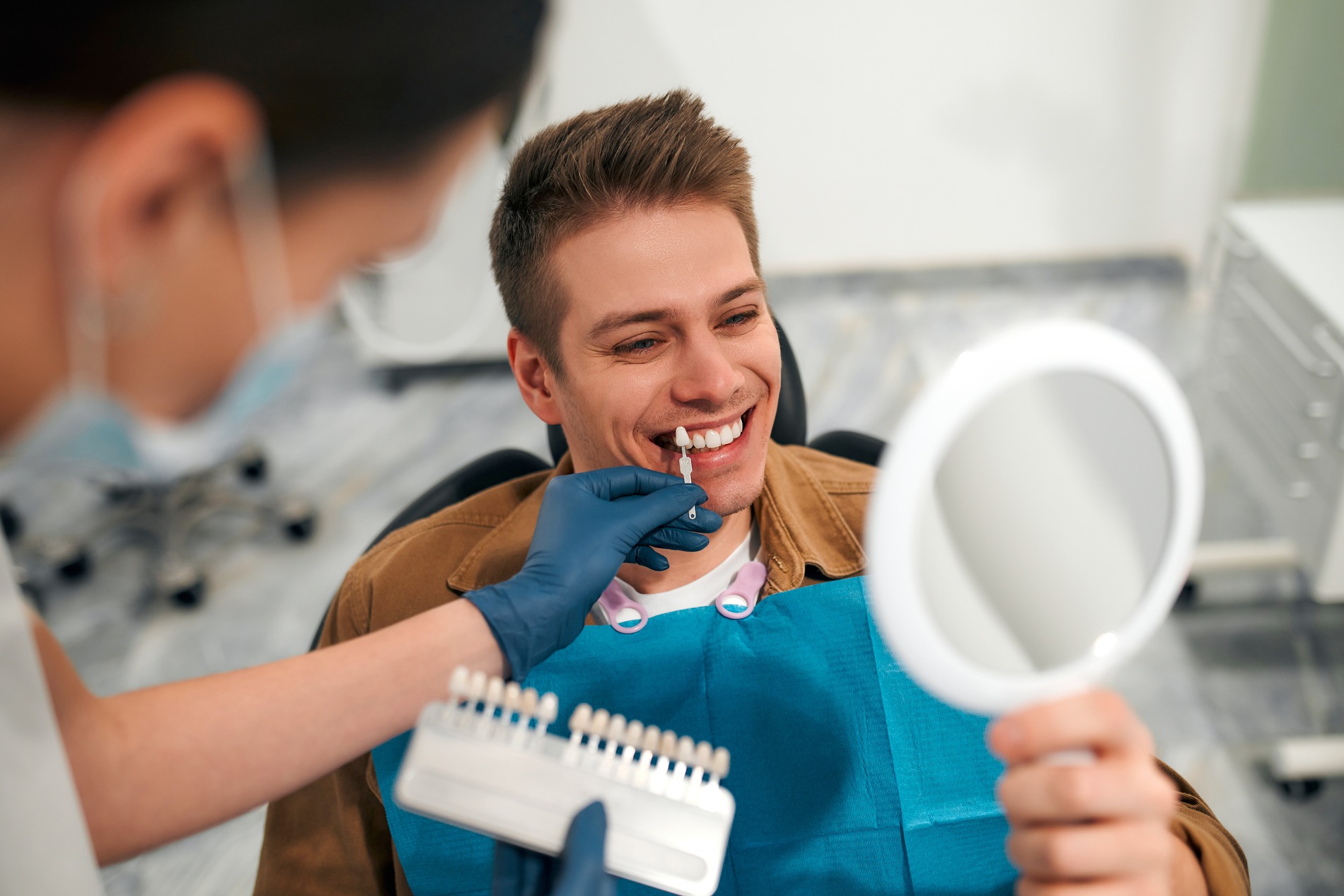 Man at his first veneers consultation in Fargo ND