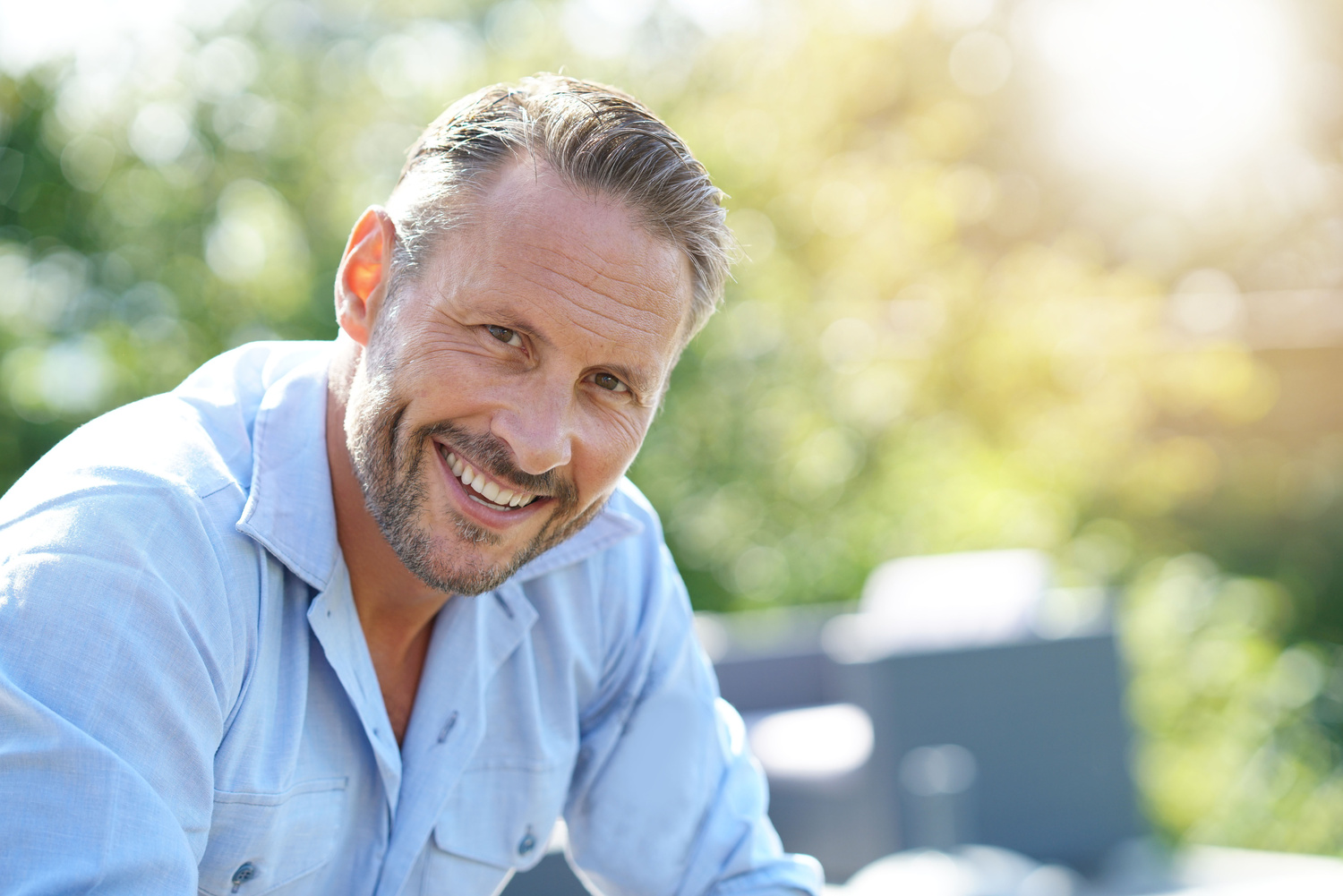 Man smiling after a fixing his smile with dental bonding in Fargo ND